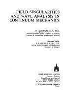 Field singularities and wave analysis in continuum mechanics