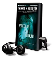 Cover of: Seduced by Moonlight by Laurell K. Hamilton, Laural Merlington