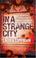 Cover of: In a Strange City (A Tess Monaghan Investigation)