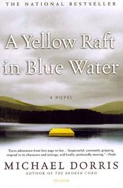 A yellow raft in blue water by Michael Dorris
