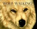 Wolf walking by Edwin Daniels