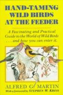 Hand-taming wild birds at the feeder by Alfred G. Martin