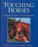 Touching horses by Marion Kaselle, Pamela Hannay
