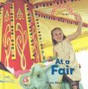 Cover of: At a Fair (Benchmark Rebus)