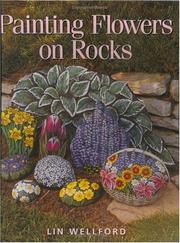 Painting flowers on rocks by Lin Wellford